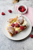 Croissant casserole with raspberries, cream cheese and maple syrup