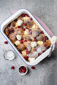 Croissant casserole with raspberries, cream cheese and maple syrup