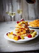 Turnip waffles with fruit and syrup