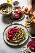 Hummus with black chickpeas and red onions