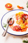 Blood orange salad with syrup and fresh rosemary