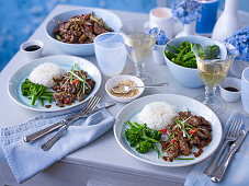 Korean style beef with rice, sesame seeds, and broccolini