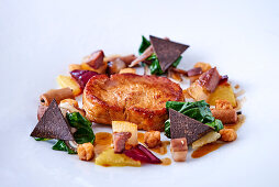 Roasted calf's nut with turnips, spinach and truffle