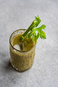 Vegetable smoothie with celery stalks