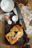 Hearty puff pastry tartlet with egg and mixed seeds