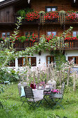 Autumn garden table in front of a farmhouse, Bavaria, Germany