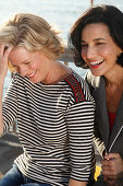 Three good-humoured girlfriends on a ship