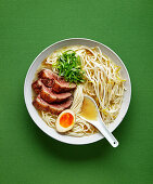 Shio ramen with duck, eggs, spring onions and bean sprouts
