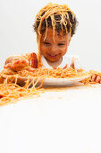 Boy eating Spaghetti with Hands