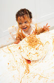 Boy eating Spaghetti with Hands