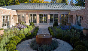 English house with brick facade and symmetrically designed courtyard