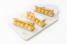 Mini mille feuille with cream and candied orange peel