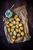 Smashed potatoes with herb crème fraiche