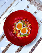 Soft-boiled egg in aspic with chanterelles and ham