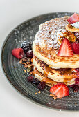 Breakfast pancakes with berries and grilled banana