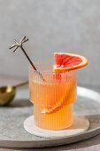 Grapefruit spritz made with Cointreau, lime juice, grapefruit juice and Prosecco