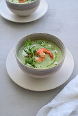 Creamy green pea soup with shrimp