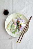 Summer rolls with glass noodles, cheese, cucumber, carrot, red cabbage, and pepper