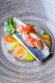 Blue trout with shrimp and vegetables