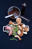 Pork chop, porcini mushrooms, rosemary, and brown sauce