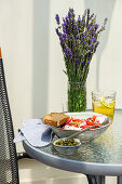 Vegetable salad with organic tomatoes and capers, served with lemonade