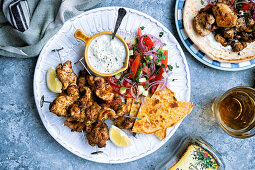 Souvlaki cooked in the air fryer, yogurt dip, salad and pita bread