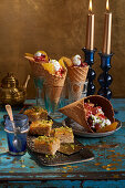 Baklava with oranges and fruit salad with cheese cream