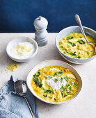 Spiced red lentil and chicken soup with greens