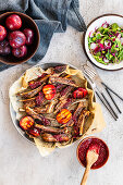 Sticky lamb ribs with plum sauce