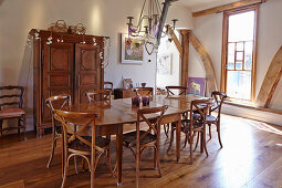 Dining area with wooden furniture in a converted barn