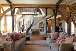 Living area in converted barn with wooden beams