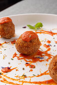 Fried meatballs with tomato sauce