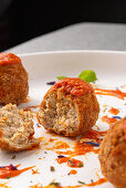 Fried meatballs with tomato sauce