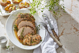 Thyme roast pork with baked potatoes