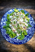 Salad with yogurt, mint, and pistachios