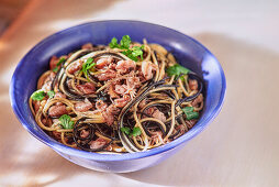 Two-coloured spaghetti with squid