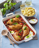 Baked chicken legs with tomatoes and mascarpone cheese