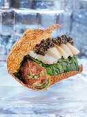 Kulebjak with scallops, salmon and caviar