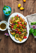 Grilled eggplant and tomato salad