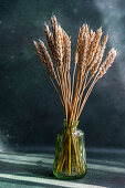 Wheat ears in glass vase