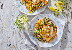 Lemon fish fillets with grilled zucchini on toast