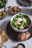 Field salad with goat cheese, grapes, and walnuts
