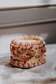 Vintage cake trend with piped buttercream ruffles and redcurrant decorations