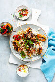 Grilled chicken and rice bowl with tzatziki