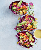 Vegan satay pumpkin bowls with quinoa and red cabbage