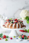 Wreath cake with summer berries and icing