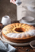 Vanilla bundt cake with chocolate chips dusted with powdered sugar