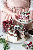 Cranberry crêpe cake with whipped cream and rosemary