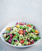Simple Italian farfalle salad with vegetables and pesto
