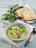 Green kohlrabi soup with fish and herbs